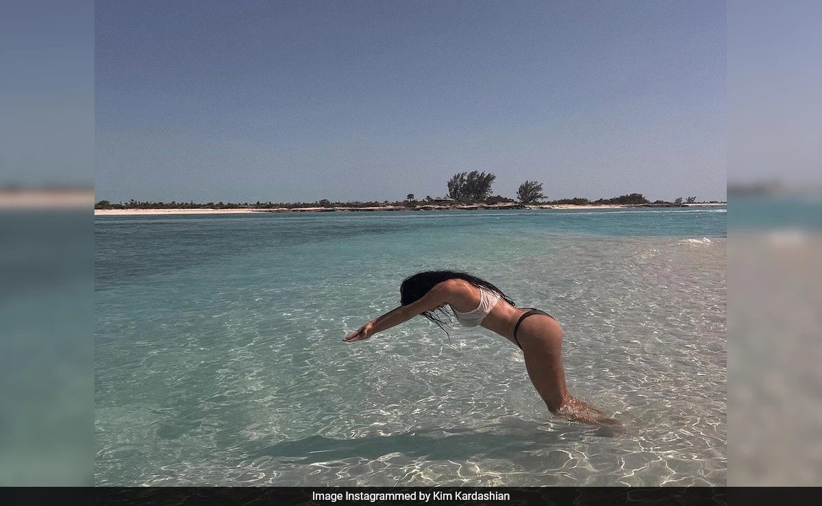 Is Kim Kardashian Diving…Or Just Posing? Fans Debate Beach Photo