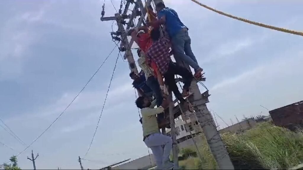 Woman Wants To Live Together With Husband, Lover. Climbs Pole In Protest